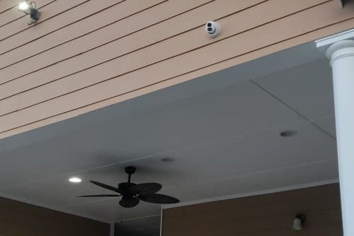 Surveillance camera mounted on exterior wall